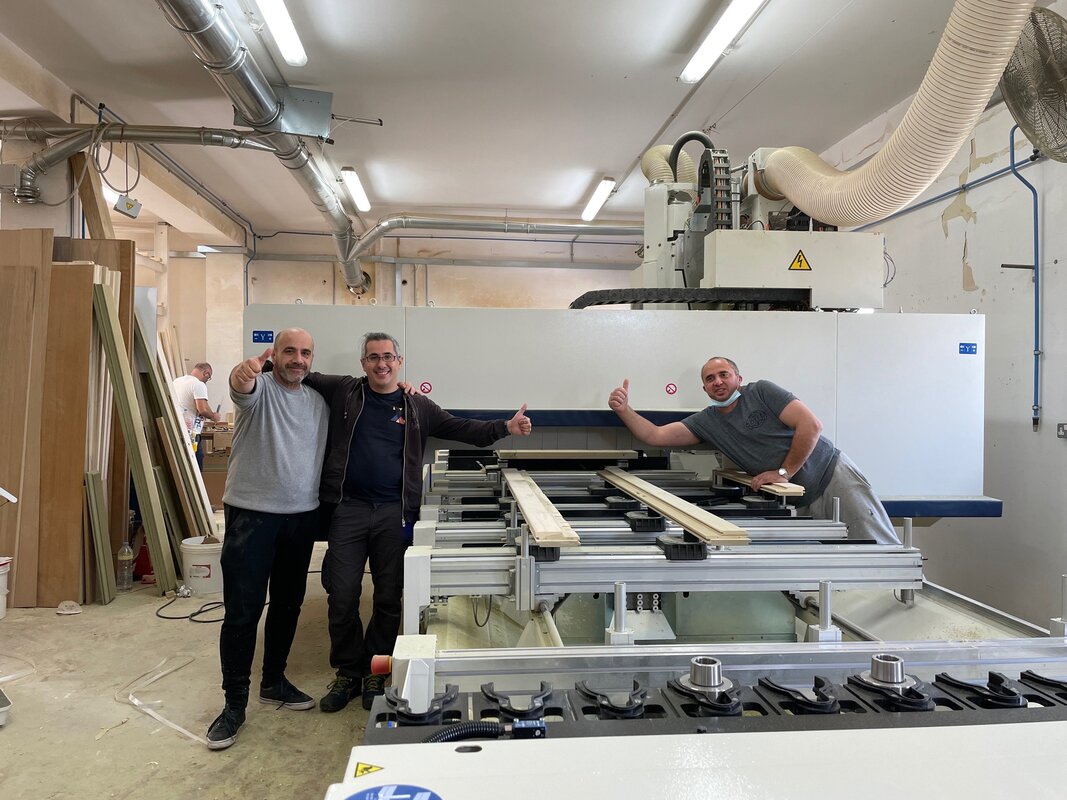 Engineer diagnosing the electrical cabinet of an SCM CNC machine
